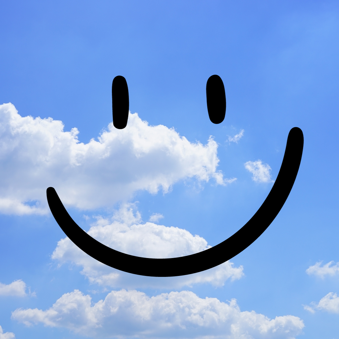 smiley face in blue sky